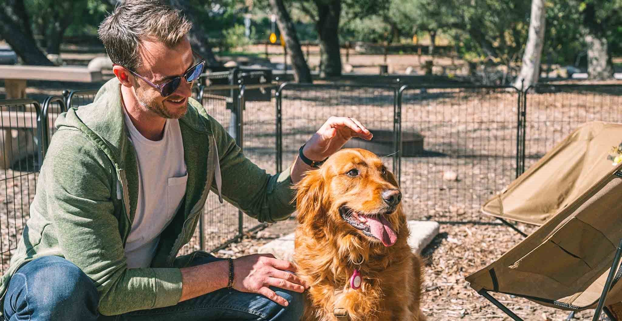 a man and a dog in playpen